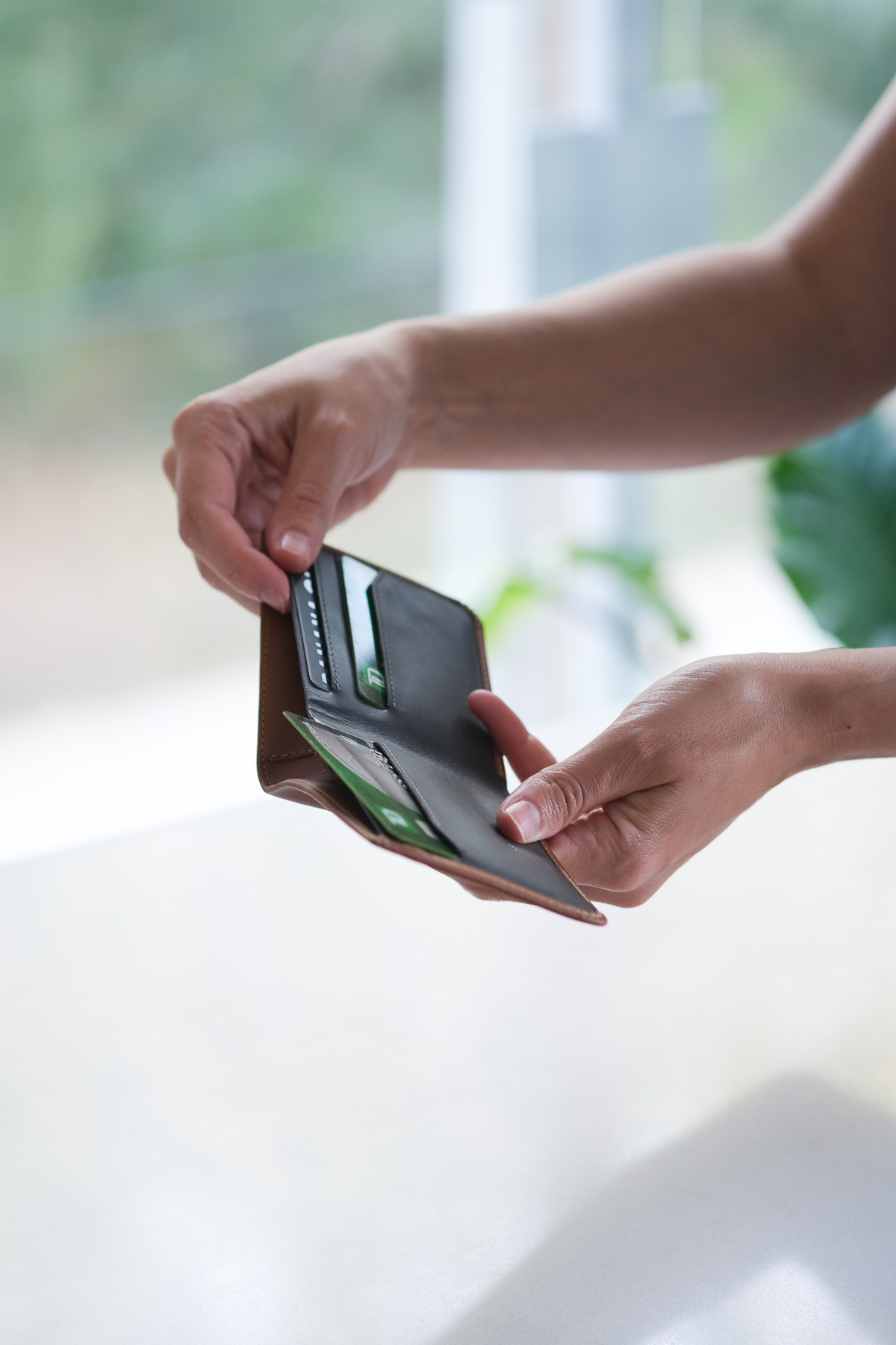 Women holding bellroy wallet with cards inside