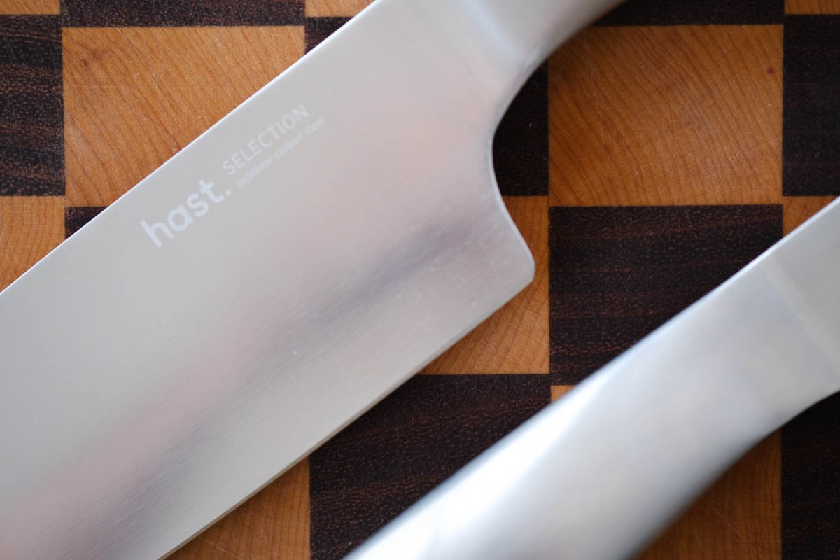 close up of 2 knives on a cutting board
